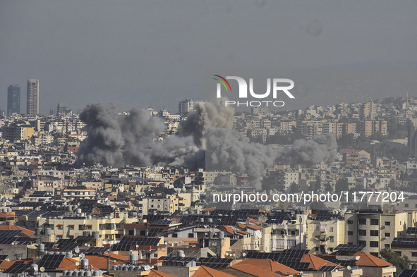 Smoke rises from a residential area after a series of Israeli airstrikes on the Dahieh region in southern Beirut, Lebanon, on November 14, 2...