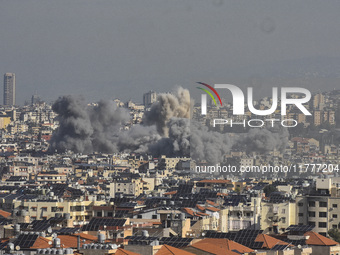 Smoke rises from a residential area after a series of Israeli airstrikes on the Dahieh region in southern Beirut, Lebanon, on November 14, 2...