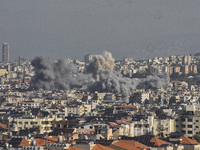 Smoke rises from a residential area after a series of Israeli airstrikes on the Dahieh region in southern Beirut, Lebanon, on November 14, 2...