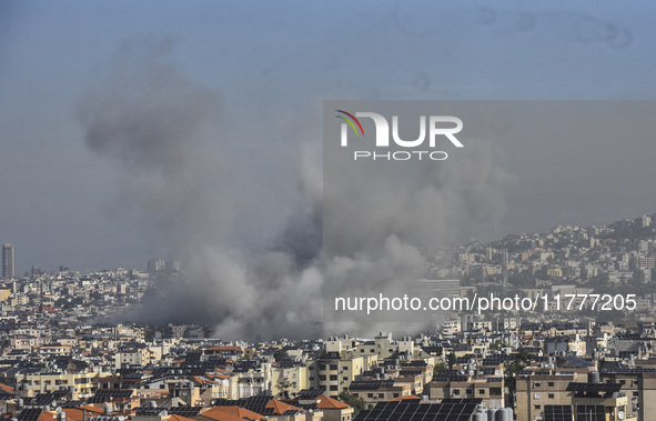 Smoke rises from a residential area after a series of Israeli airstrikes on the Dahieh region in southern Beirut, Lebanon, on November 14, 2...