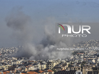 Smoke rises from a residential area after a series of Israeli airstrikes on the Dahieh region in southern Beirut, Lebanon, on November 14, 2...