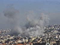 Smoke rises from a residential area after a series of Israeli airstrikes on the Dahieh region in southern Beirut, Lebanon, on November 14, 2...