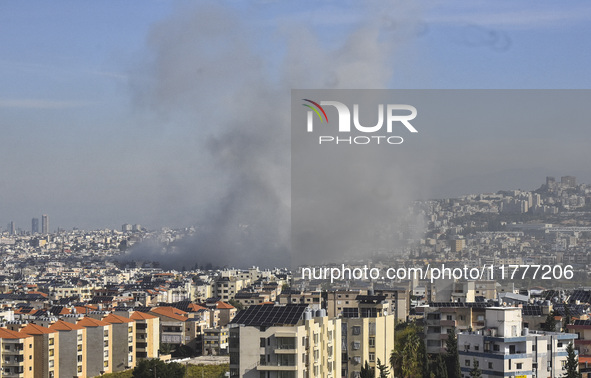 Smoke rises from a residential area after a series of Israeli airstrikes on the Dahieh region in southern Beirut, Lebanon, on November 14, 2...