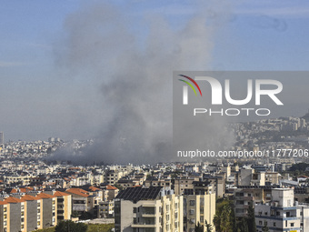 Smoke rises from a residential area after a series of Israeli airstrikes on the Dahieh region in southern Beirut, Lebanon, on November 14, 2...