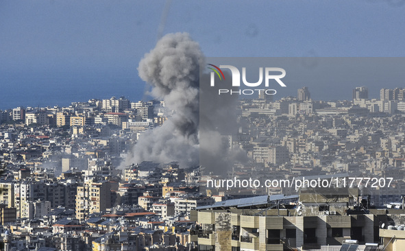 Smoke rises from a residential area after a series of Israeli airstrikes on the Dahieh region in southern Beirut, Lebanon, on November 14, 2...