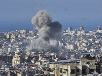 Smoke rises from a residential area after a series of Israeli airstrikes on the Dahieh region in southern Beirut, Lebanon, on November 14, 2...