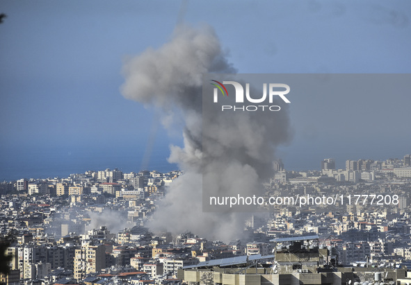 Smoke rises from a residential area after a series of Israeli airstrikes on the Dahieh region in southern Beirut, Lebanon, on November 14, 2...