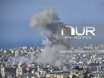 Smoke rises from a residential area after a series of Israeli airstrikes on the Dahieh region in southern Beirut, Lebanon, on November 14, 2...