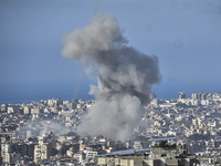 Smoke rises from a residential area after a series of Israeli airstrikes on the Dahieh region in southern Beirut, Lebanon, on November 14, 2...