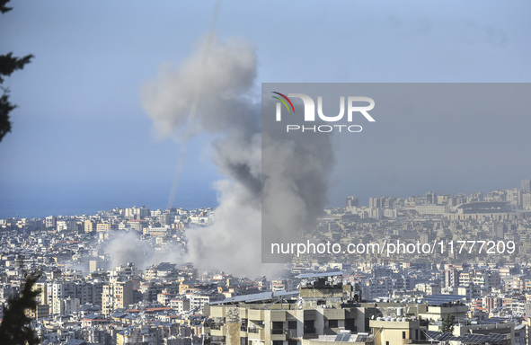 Smoke rises from a residential area after a series of Israeli airstrikes on the Dahieh region in southern Beirut, Lebanon, on November 14, 2...