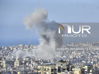 Smoke rises from a residential area after a series of Israeli airstrikes on the Dahieh region in southern Beirut, Lebanon, on November 14, 2...