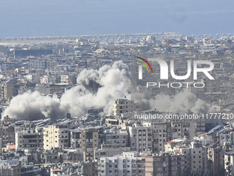 Smoke rises from a residential area after a series of Israeli airstrikes on the Dahieh region in southern Beirut, Lebanon, on November 14, 2...