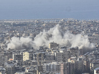 Smoke rises from a residential area after a series of Israeli airstrikes on the Dahieh region in southern Beirut, Lebanon, on November 14, 2...