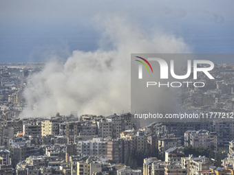 Smoke rises from a residential area after a series of Israeli airstrikes on the Dahieh region in southern Beirut, Lebanon, on November 14, 2...