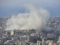 Smoke rises from a residential area after a series of Israeli airstrikes on the Dahieh region in southern Beirut, Lebanon, on November 14, 2...