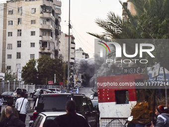 Smoke rises from a residential area after a series of Israeli airstrikes on the Dahieh region in southern Beirut, Lebanon, on November 14, 2...