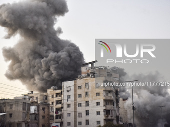 Smoke rises from a residential area after a series of Israeli airstrikes on the Dahieh region in southern Beirut, Lebanon, on November 14, 2...