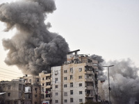 Smoke rises from a residential area after a series of Israeli airstrikes on the Dahieh region in southern Beirut, Lebanon, on November 14, 2...