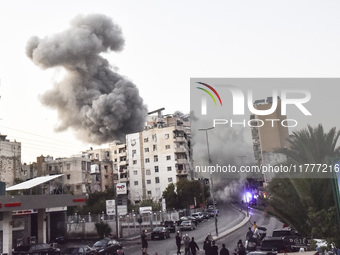 Smoke rises from a residential area after a series of Israeli airstrikes on the Dahieh region in southern Beirut, Lebanon, on November 14, 2...