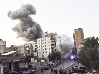 Smoke rises from a residential area after a series of Israeli airstrikes on the Dahieh region in southern Beirut, Lebanon, on November 14, 2...