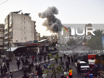 Smoke rises from a residential area after a series of Israeli airstrikes on the Dahieh region in southern Beirut, Lebanon, on November 14, 2...