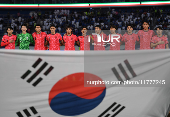 Players of Korea Republic stand for their national anthem during the AFC Asian Qualifiers Road to 26 match between Kuwait and Korea Republic...