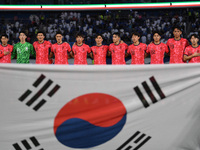 Players of Korea Republic stand for their national anthem during the AFC Asian Qualifiers Road to 26 match between Kuwait and Korea Republic...