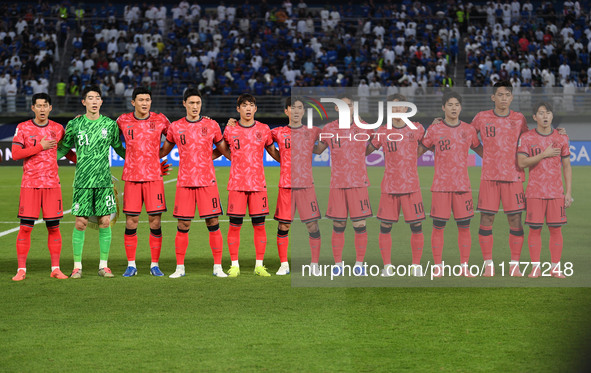 Players of Korea Republic stand for their national anthem during the AFC Asian Qualifiers Road to 26 match between Kuwait and Korea Republic...