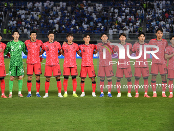 Players of Korea Republic stand for their national anthem during the AFC Asian Qualifiers Road to 26 match between Kuwait and Korea Republic...