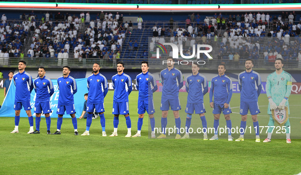 Players of Kuwait stand for their national anthem during the AFC Asian Qualifiers Road to 26 match between Kuwait and Korea Republic in Kuwa...