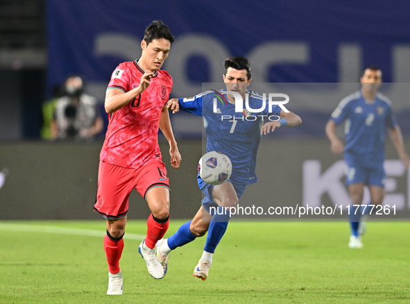 Mohammad Abdullah of Kuwait competes against Park Yongwoo of Korea Republic during the AFC Asian Qualifiers Road to 26 match between Kuwait...