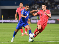 Sami Al Sanea of Kuwait competes against Park Yongwoo of Korea Republic during the AFC Asian Qualifiers Road to 26 match between Kuwait and...