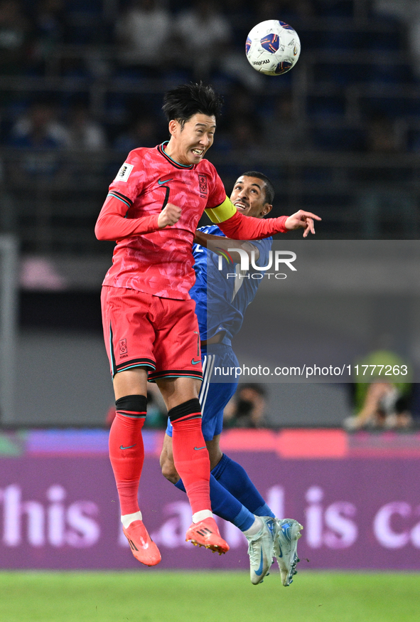 Sami Alsanea of Kuwait competes against Son Heung Min of Korea Republic during the AFC Asian Qualifiers Road to 26 match between Kuwait and...