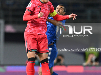 Sami Alsanea of Kuwait competes against Son Heung Min of Korea Republic during the AFC Asian Qualifiers Road to 26 match between Kuwait and...