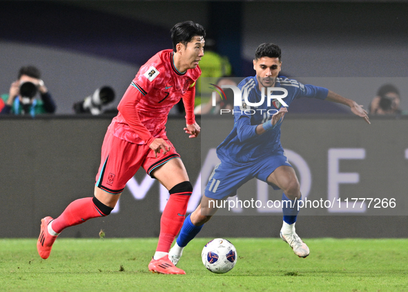 Ali Matar of Kuwait competes against Son Heung Min of Korea Republic during the AFC Asian Qualifiers Road to 26 match between Kuwait and Kor...