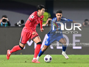 Ali Matar of Kuwait competes against Son Heung Min of Korea Republic during the AFC Asian Qualifiers Road to 26 match between Kuwait and Kor...