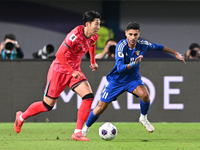 Ali Matar of Kuwait competes against Son Heung Min of Korea Republic during the AFC Asian Qualifiers Road to 26 match between Kuwait and Kor...