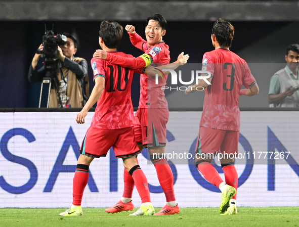 Son Heung Min (C) of Korea Republic celebrates after scoring a goal during the AFC Asian Qualifiers Road to 26 match between Kuwait and Kore...