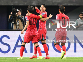 Son Heung Min (C) of Korea Republic celebrates after scoring a goal during the AFC Asian Qualifiers Road to 26 match between Kuwait and Kore...