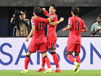 Son Heung Min (C) of Korea Republic celebrates after scoring a goal during the AFC Asian Qualifiers Road to 26 match between Kuwait and Kore...