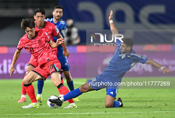 Redha Abujabarah of Kuwait competes against Lee Jaesung of Korea Republic during the AFC Asian Qualifiers Road to 26 match between Kuwait an...