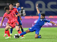 Redha Abujabarah of Kuwait competes against Lee Jaesung of Korea Republic during the AFC Asian Qualifiers Road to 26 match between Kuwait an...