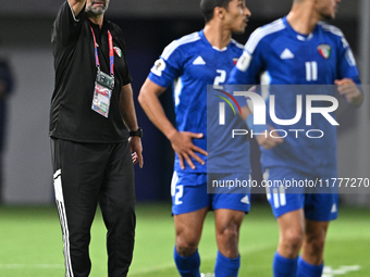 Head Coach of the Kuwait National team, Juan Pizzi (L), reacts during the AFC Asian Qualifiers Road to 26 match between Kuwait and Korea Rep...