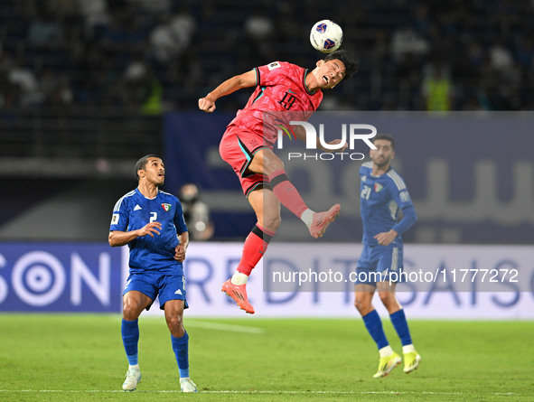 Oh Sehun (C) of Korea Republic is in action during the AFC Asian Qualifiers Road to 26 match between Kuwait and Korea Republic in Kuwait Cit...