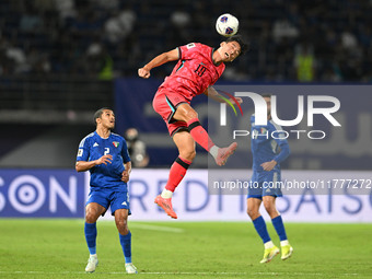 Oh Sehun (C) of Korea Republic is in action during the AFC Asian Qualifiers Road to 26 match between Kuwait and Korea Republic in Kuwait Cit...