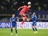 Oh Sehun (C) of Korea Republic is in action during the AFC Asian Qualifiers Road to 26 match between Kuwait and Korea Republic in Kuwait Cit...