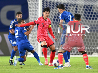 Son Heung Min (C) of Korea Republic is in action during the AFC Asian Qualifiers Road to 26 match between Kuwait and Korea Republic in Kuwai...