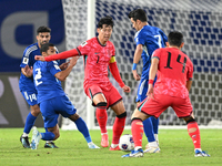 Son Heung Min (C) of Korea Republic is in action during the AFC Asian Qualifiers Road to 26 match between Kuwait and Korea Republic in Kuwai...