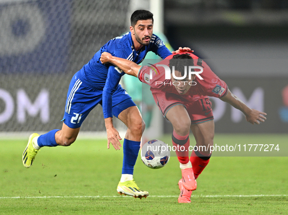 Hasan Alanezi of Kuwait competes against Kim Bongsoo of Korea Republic during the AFC Asian Qualifiers Road to 26 match between Kuwait and K...