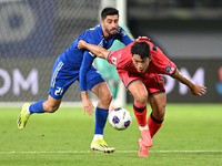 Hasan Alanezi of Kuwait competes against Kim Bongsoo of Korea Republic during the AFC Asian Qualifiers Road to 26 match between Kuwait and K...